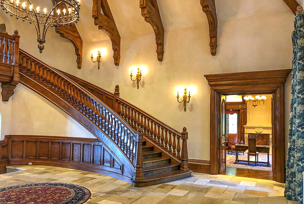 sweeping staircase in carmel valley custom home